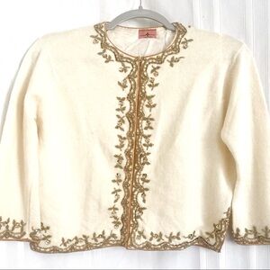 Vintage 1950’s beautiful crème sweater . Hand sewn gold trim with gold beads.